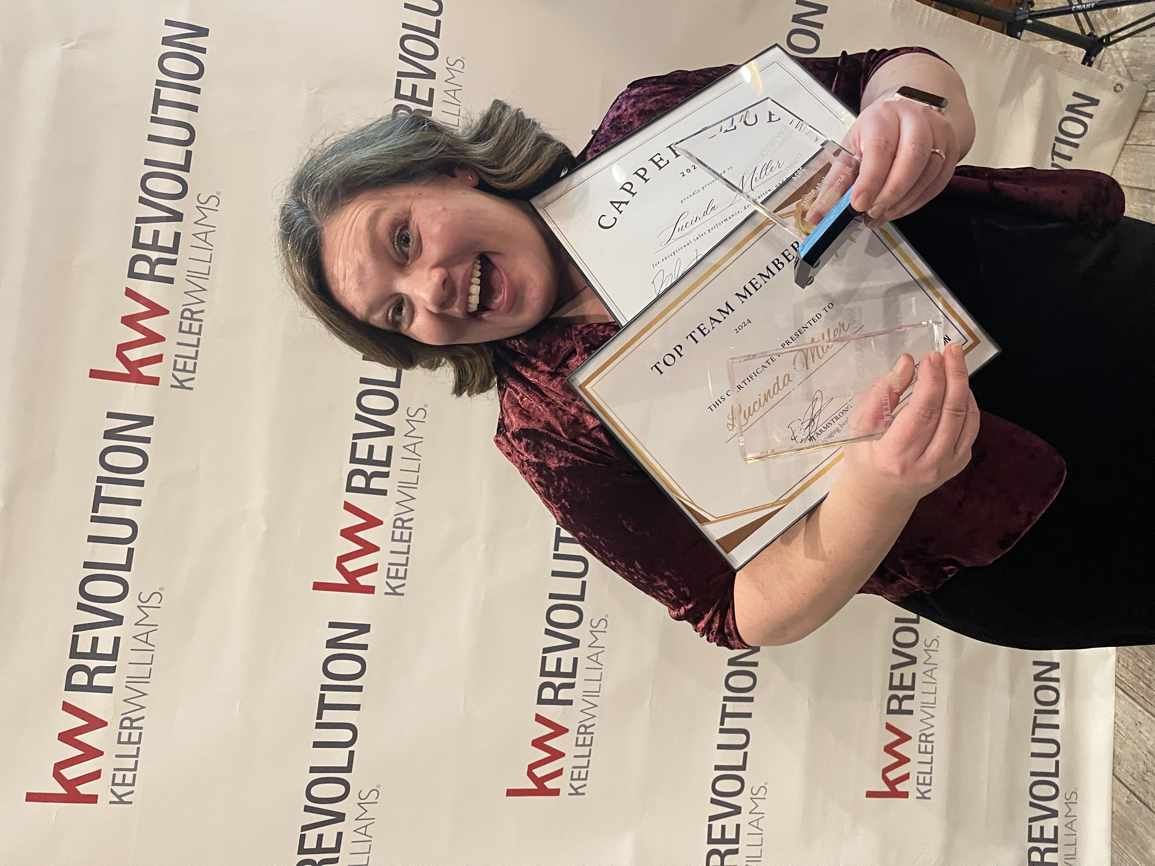 Lucinda Miller with her Keller Williams awards
